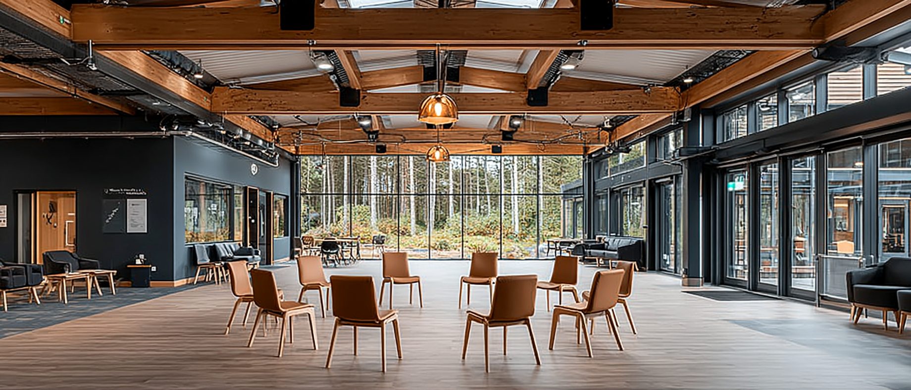 Warm community hall with a circle of chairs set up for a group session
